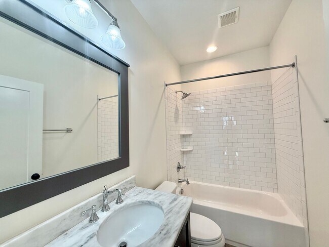 Building Photo - Custom Built 4BD, 3.5BA Five Points Home with a Bonus Room & Fenced Yard