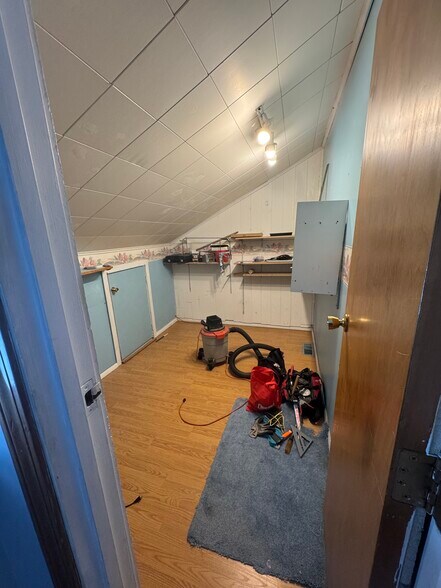 Extra room with attic space. Can be used for storage, home gym, workshop, office/studio space, etc! - 705 Lake Ave