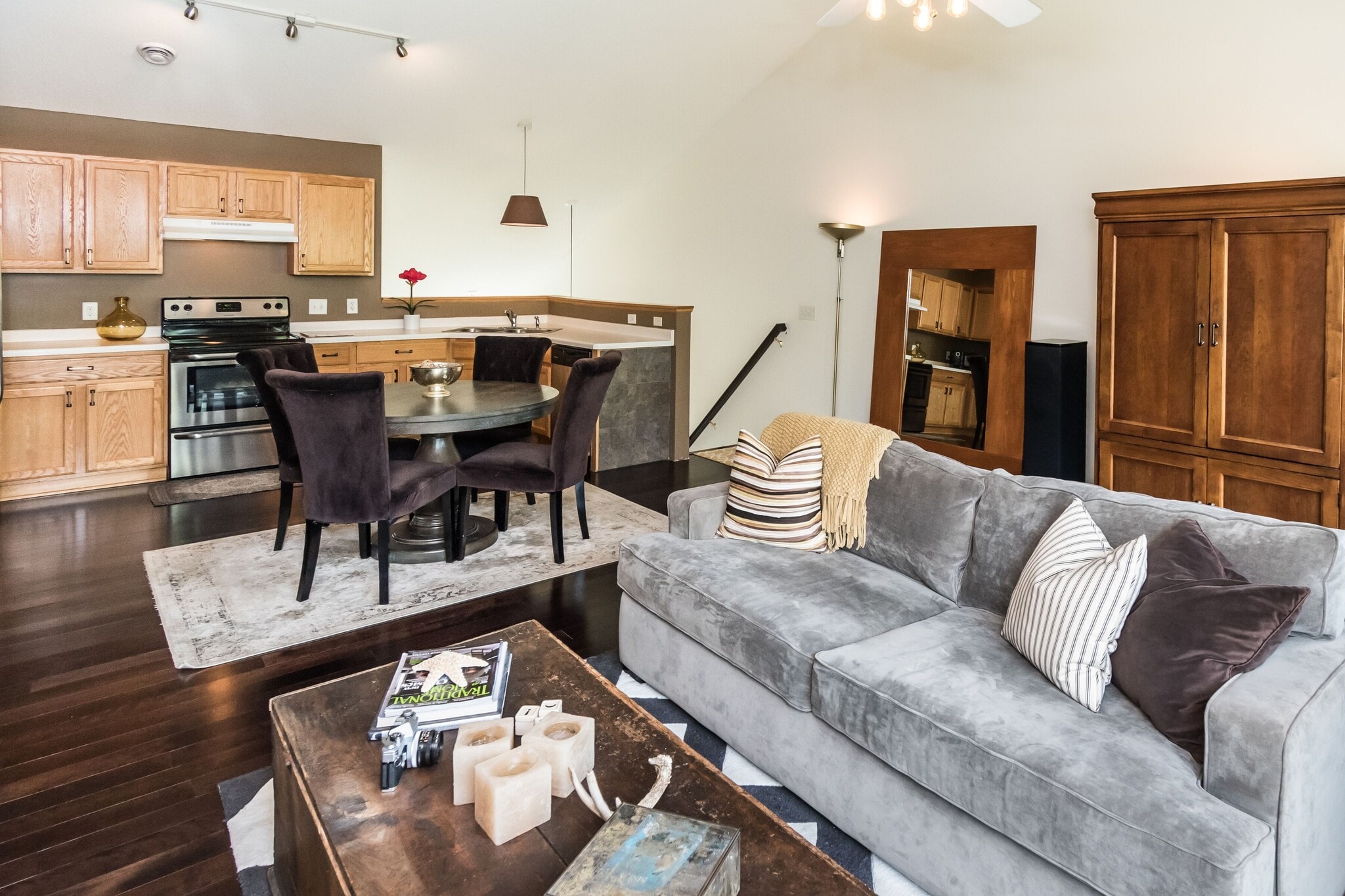 Open concept kitchen and living room with vaulted ceilings. - 1102 Bergmann Dr