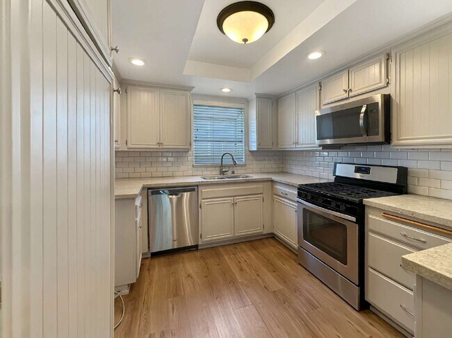 Building Photo - Beautifully Updated Lower-Level Condo with...