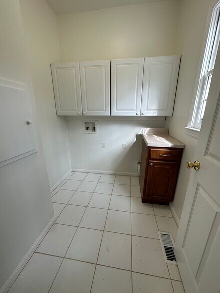 Utility Room with Laundry Chute - 7675 Paces Ln