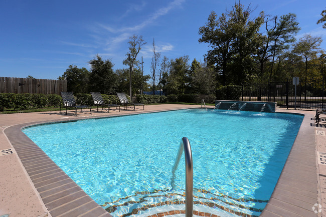 Sparkling pool with sundeck and waterfall - Woodside Manor