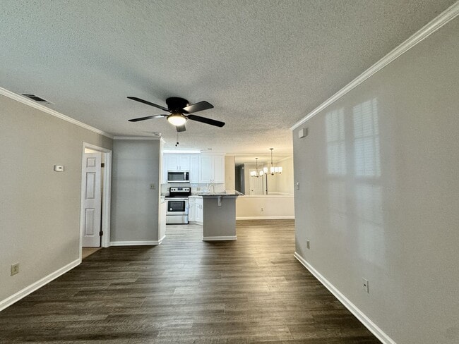 Building Photo - Updated 1st Floor/1-Level Condo Available NOW & Rent Includes Water, Sewer, Trash, Landscaping, F...