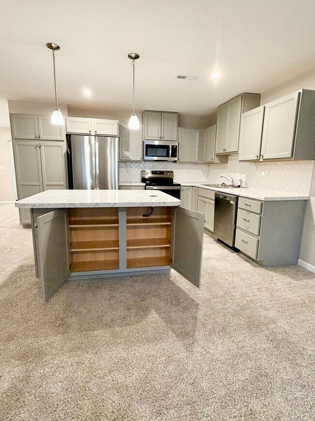 Building Photo - Exquisite brand new condo w/everything! Ground floor, no stairs, attached garage