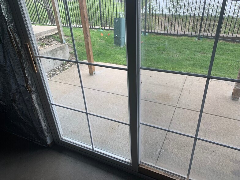 Basement sliding door leading to slab patio. - 281 Hickory Lane