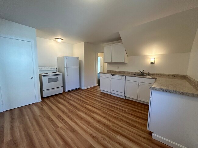 Bright eat in kitchen. Includes dishwasher and large pantry closet. - 12 Everett St
