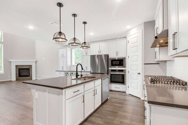 Building Photo - "Spacious 4-Bedroom Sanctuary with Cozy Fireplace in San Antonio's Prime Location!"