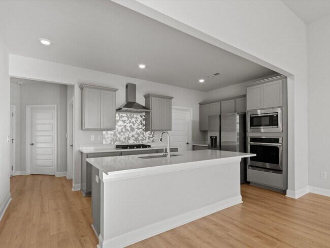 Building Photo - 3 Car Garage! Modern end-unit townhome located in the desirable Clift Farm!