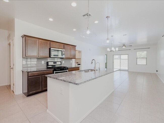 Building Photo - 3 Bedroom 2 Bathroom With Den      SOLAR PANELS! BRAND NEW FULL INTERIOR PAINT!! BRAND NEW EPOXY ...