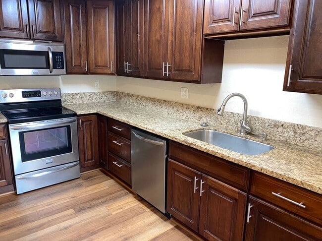 Building Photo - Upgraded 2 bedroom condo in a gated commun...