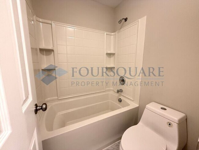 Building Photo - Lovely 3-Bedroom Townhome with Fireplace, Back Patio  & Community Amenities Included! Convenient ...