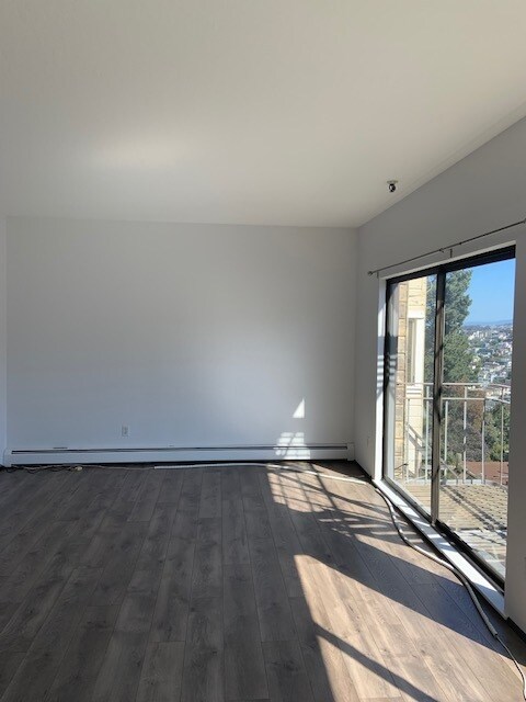 living room w/ wood flooring - 8 Museum Way