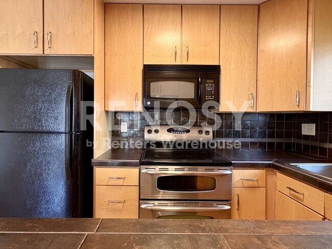 Building Photo - Extremely Well Located and Updated 2 Bed/ 1 Bath Condo with direct Garage Access