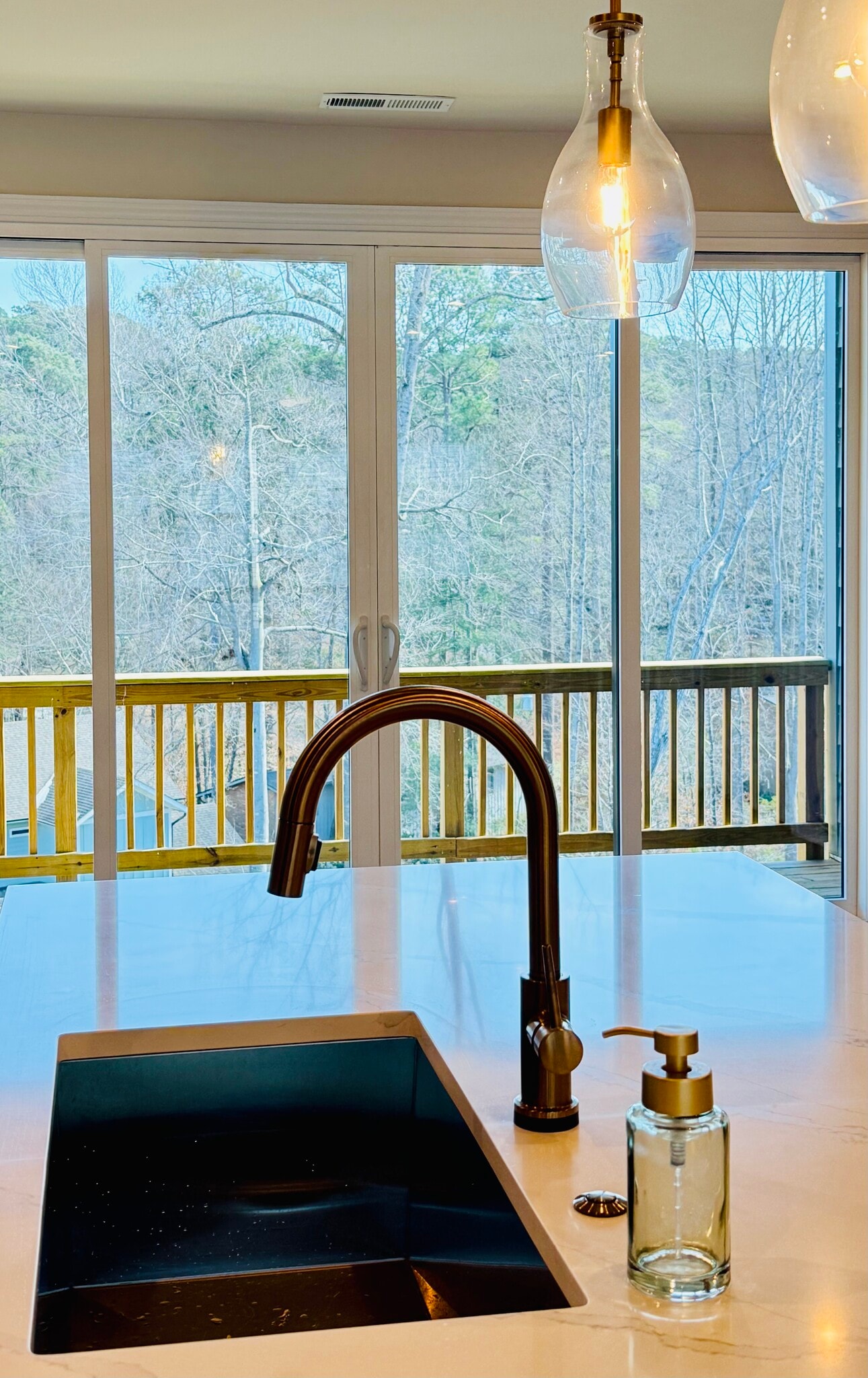 Seamless indoor-outdoor flow to private balcony with wooded views. - 4720 Cypress Tree Ln