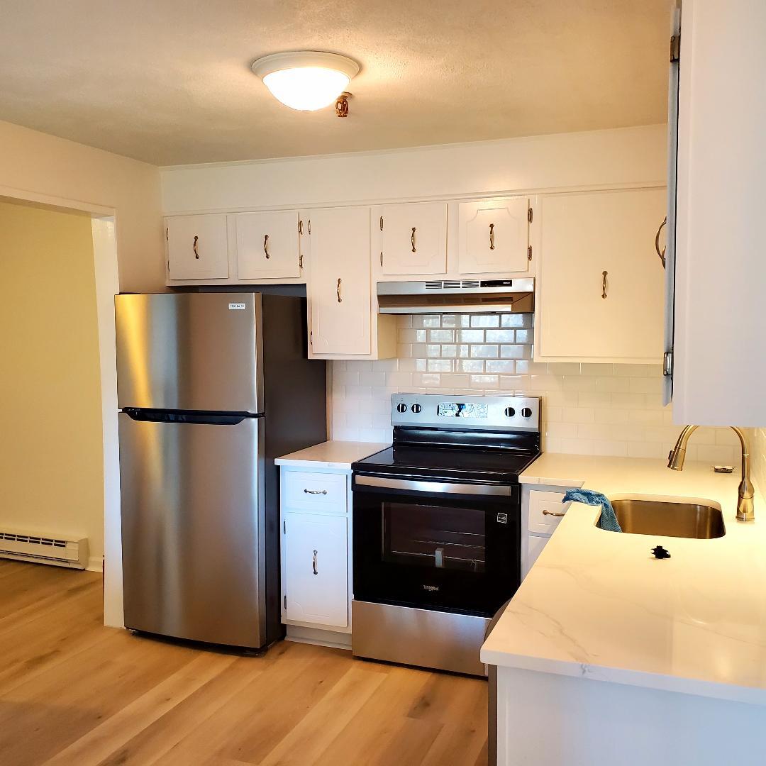 Kitchen with new quartz counters - 49 Spencer Rd