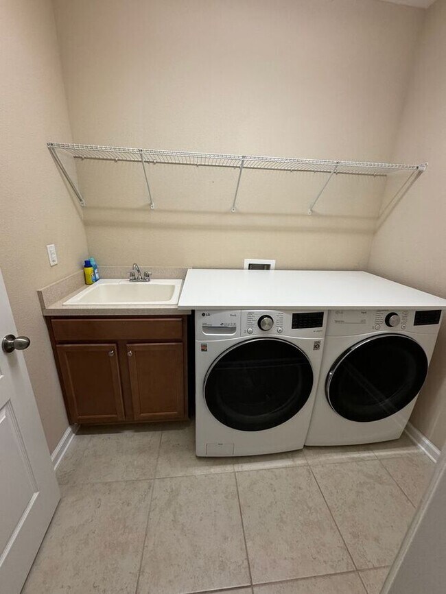 Building Photo - COMING SOON! Beautiful 4BR 3BA Home w/ Screened Lanai & Pond View • Garage Parking • Fenced Yard ...