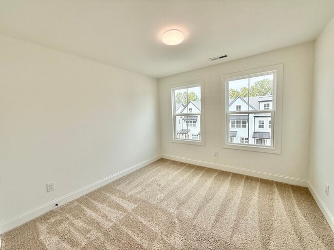 Building Photo - **OFFERING 1/2 OFF FIRST MONTH'S RENT** Newly Built 4BD, 3.5BA End-Unit Raleigh Townhome in a Gre...