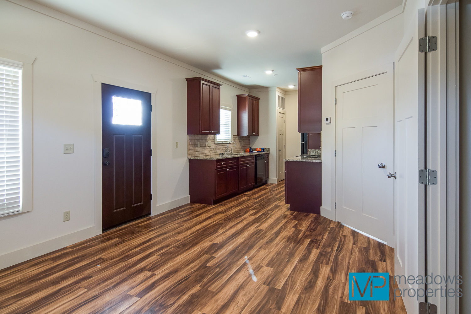 Riverwalk Living Room into Kitchen - Copper Springs by Meadows Properties