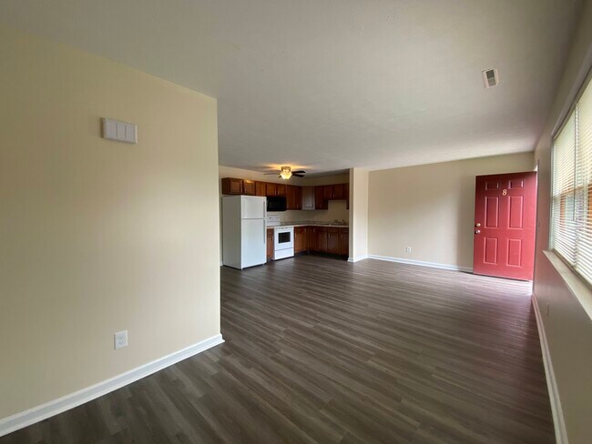 Open Layout Living Room and Eat-in Kitchen - Burdick Estates Apartments