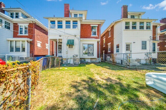 Building Photo - Charming 5-Bedroom Home with Exposed Brick and Modern Upgrades