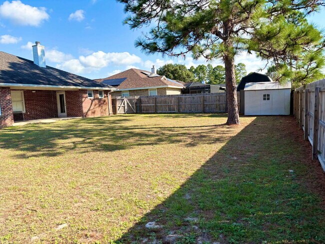 Building Photo - "Charming 4-Bed home in Navarre!"