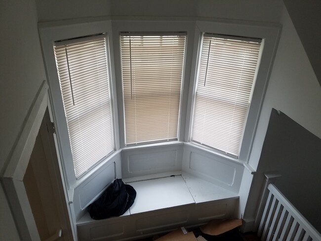 Bay window on stair landing - 4907 Atlantic Ave