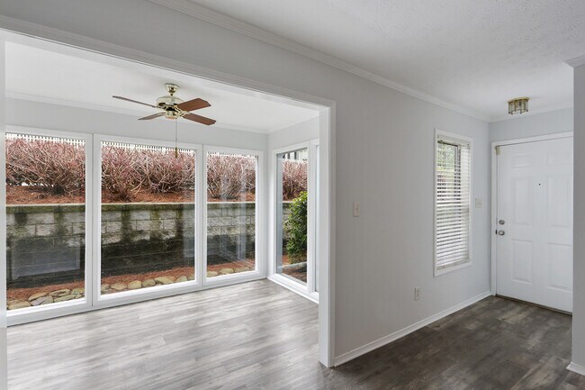 View of Sunroom and entry door from living area - 1203 Vicksburg Pl
