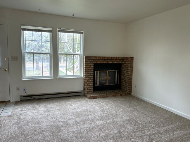 Building Photo - Quiet and Sunlit Townhome with Attached Garage and Washer/Dryer Included