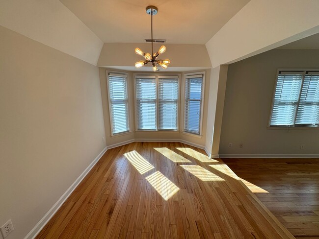 Building Photo - Top-Floor End Unit Condo at New Bern Place