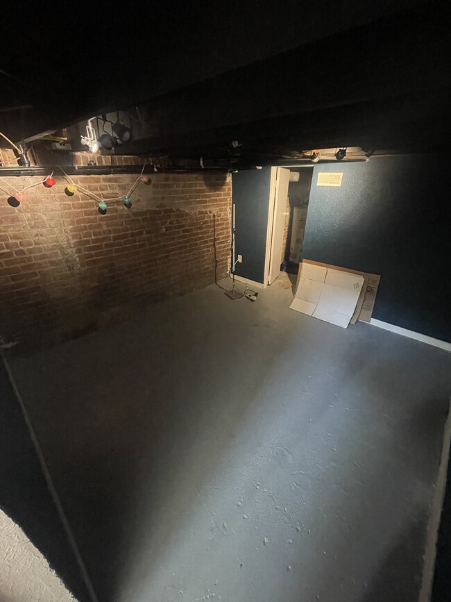 basement office / flex space with expose brick - 1615 Hooker St