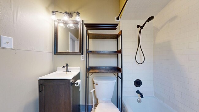 Building Photo - 3- Bedroom, 1- Bath Home with a 2 Car Gara...