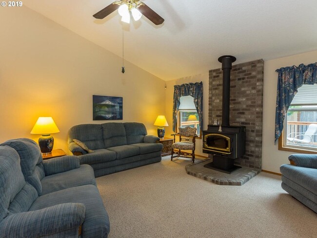 Building Photo - Charming 4-Bed, 2-Bath Home with Vaulted Ceilings, Dual Fireplaces & Serene Outdoor Spaces