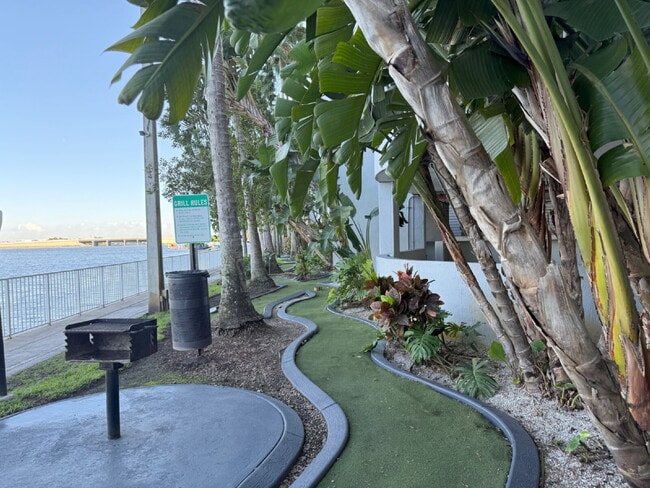 Building Photo - Rare 2/2 Corner Penthouse with Panoramic Lagoon Views from Every Room – Available Now!