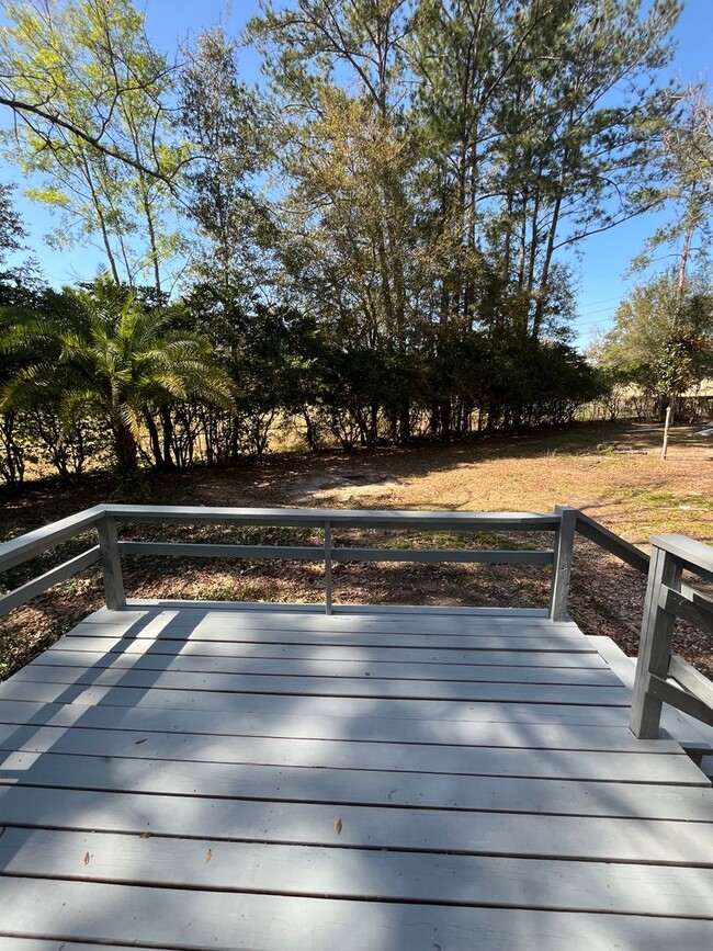 Building Photo - 3/2  home fenced in backyard located acros...