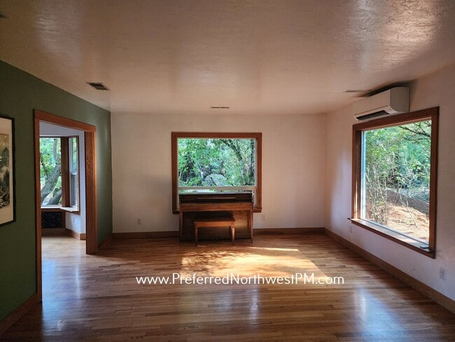 Building Photo - Beautiful home on 2 organically-landscape ...