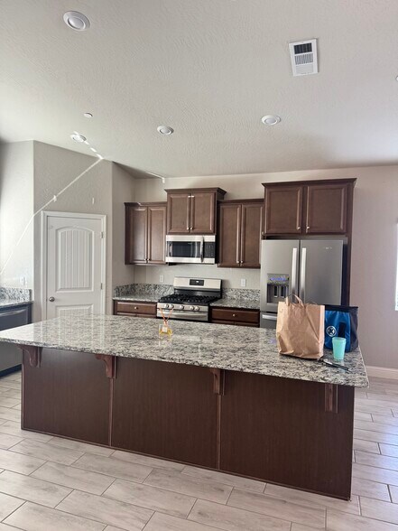 Large open kitchen with tons of storage - 11281 E Belmont Ave