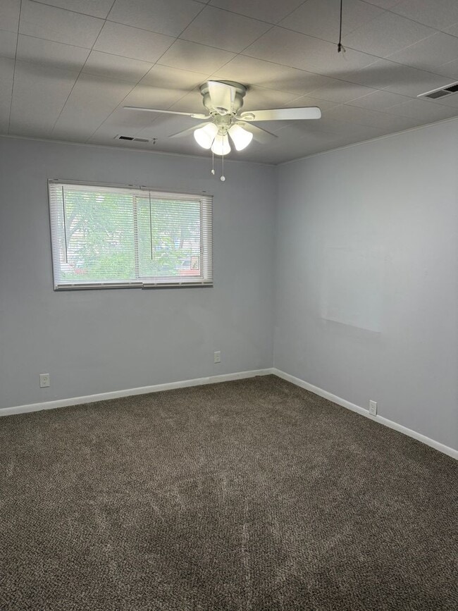 Building Photo - 3BR/1BA with overside detached garage read...