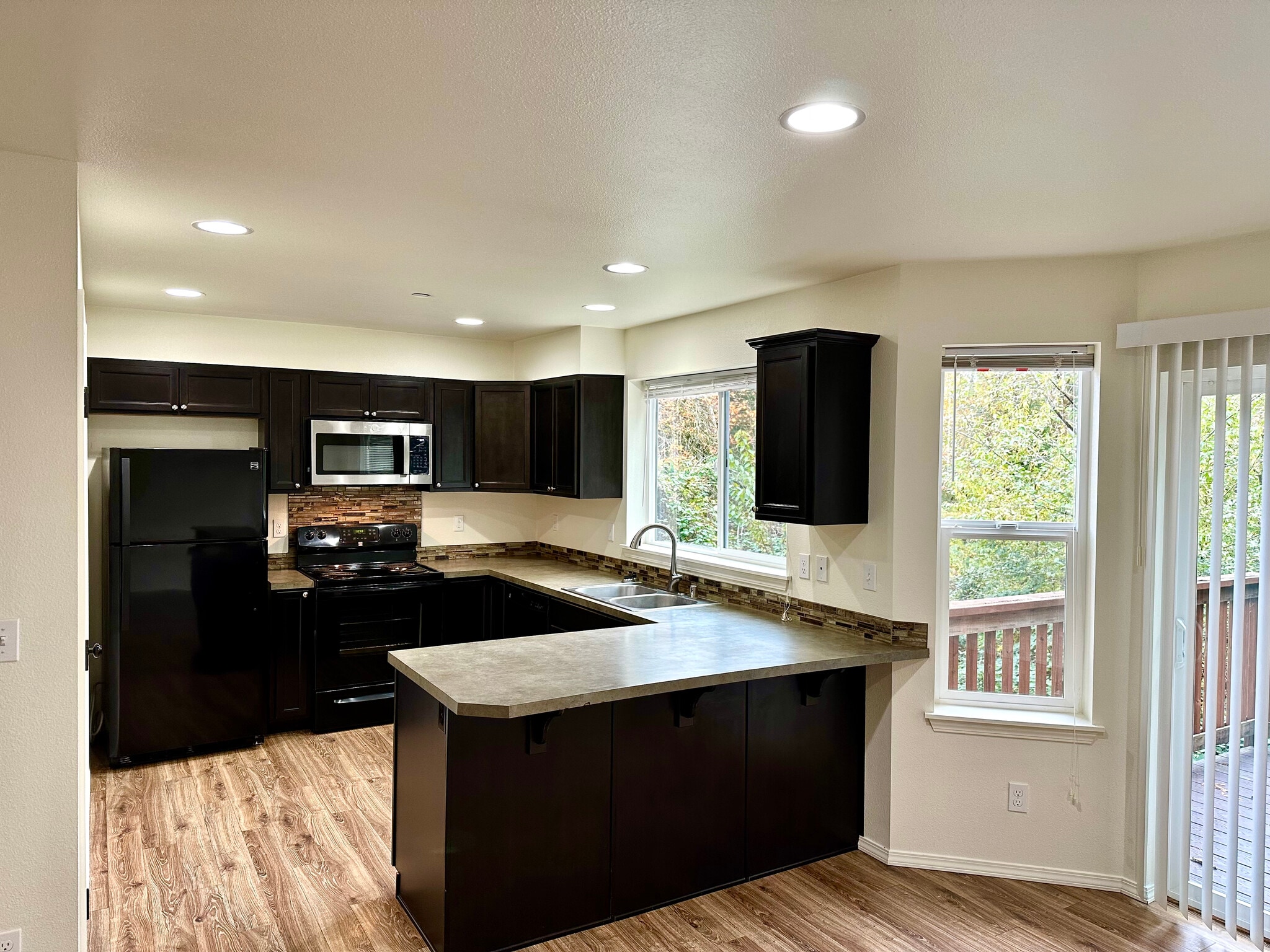 Bright kitchen work space with lots of cabinet and counter space. - 1747 Vela Ln SW