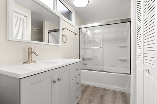 Building Photo - Charming Updated Home With Drive-Through Garage Access
