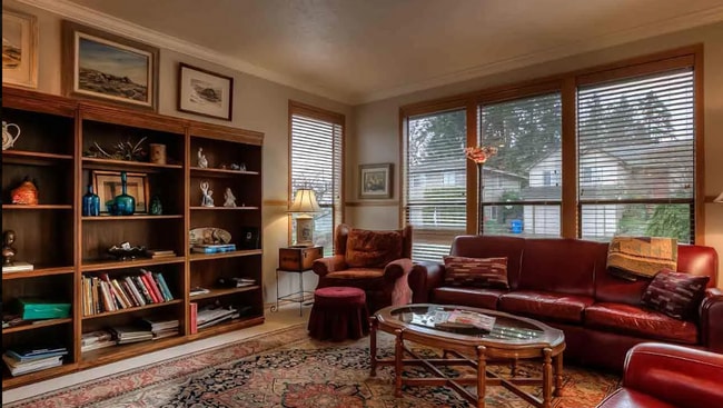 Building Photo - 4bd/3ba HUGE Home w/Hardwood Floors, Russian Fireplace, 2-Car Garage & Fenced Back Yard!