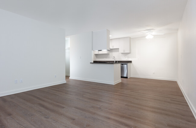 Living area and kitchen with hard surface flooring - eaves Fremont