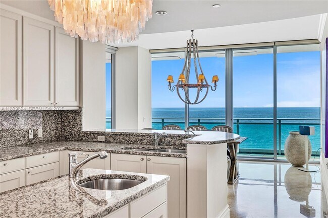 Building Photo - 10295 Collins Ave