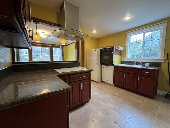 Building Photo - Classic Brick Portland Home on Stark Street with Dual Living Areas and Two Full Kitchens