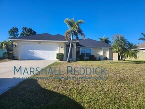 Building Photo - 3 BED 2 BATH SINGLE FAMILY HOME ON FRESH WATER CANAL WITH DOCK