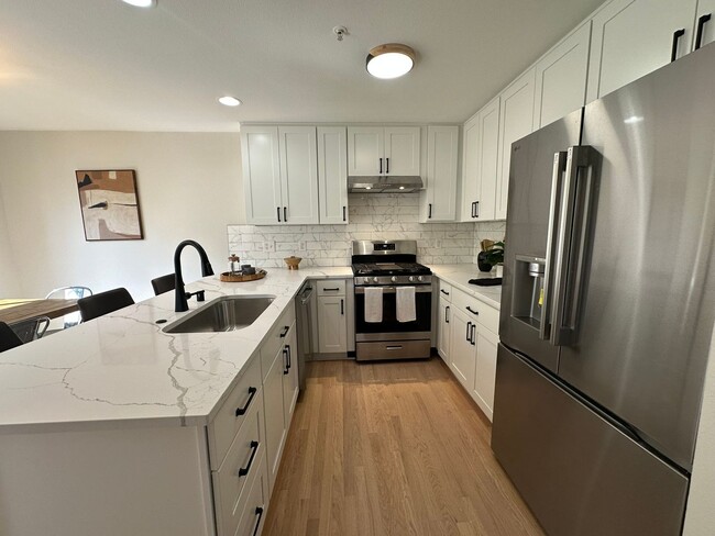 Building Photo - Updated 3-Story Condo with Balconies in So...