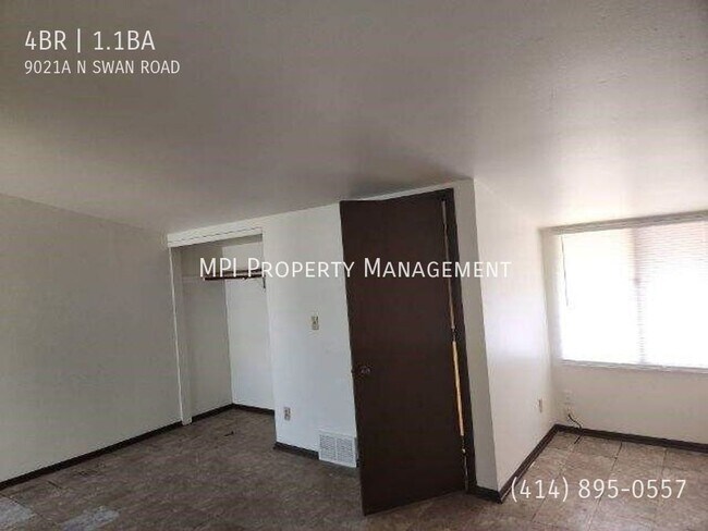 Building Photo - 9021 N Swan Rd
