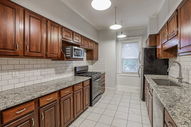 Updated kitchen with SS appliances and tons of cabinet space - 4333 Charlotte St