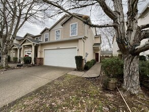 Building Photo - Inviting Two-Story 3BR Home Featuring New Carpet, New Stainless Appliances, Spacious Garage Stora...