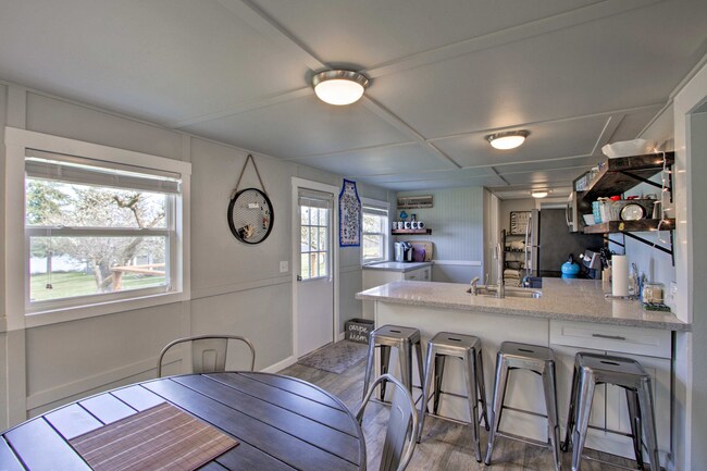 Building Photo - Island Adventure Awaits | Cozy 3BR Waterfront Home