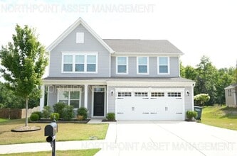 Building Photo - This wonderful home has a covered rocking ...